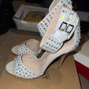 Silver with colorful rhinestones, size 8 1/2 , they are new never worn